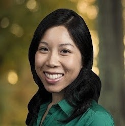 A close-up of a woman smiling