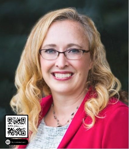 a woman with long hair and glasses